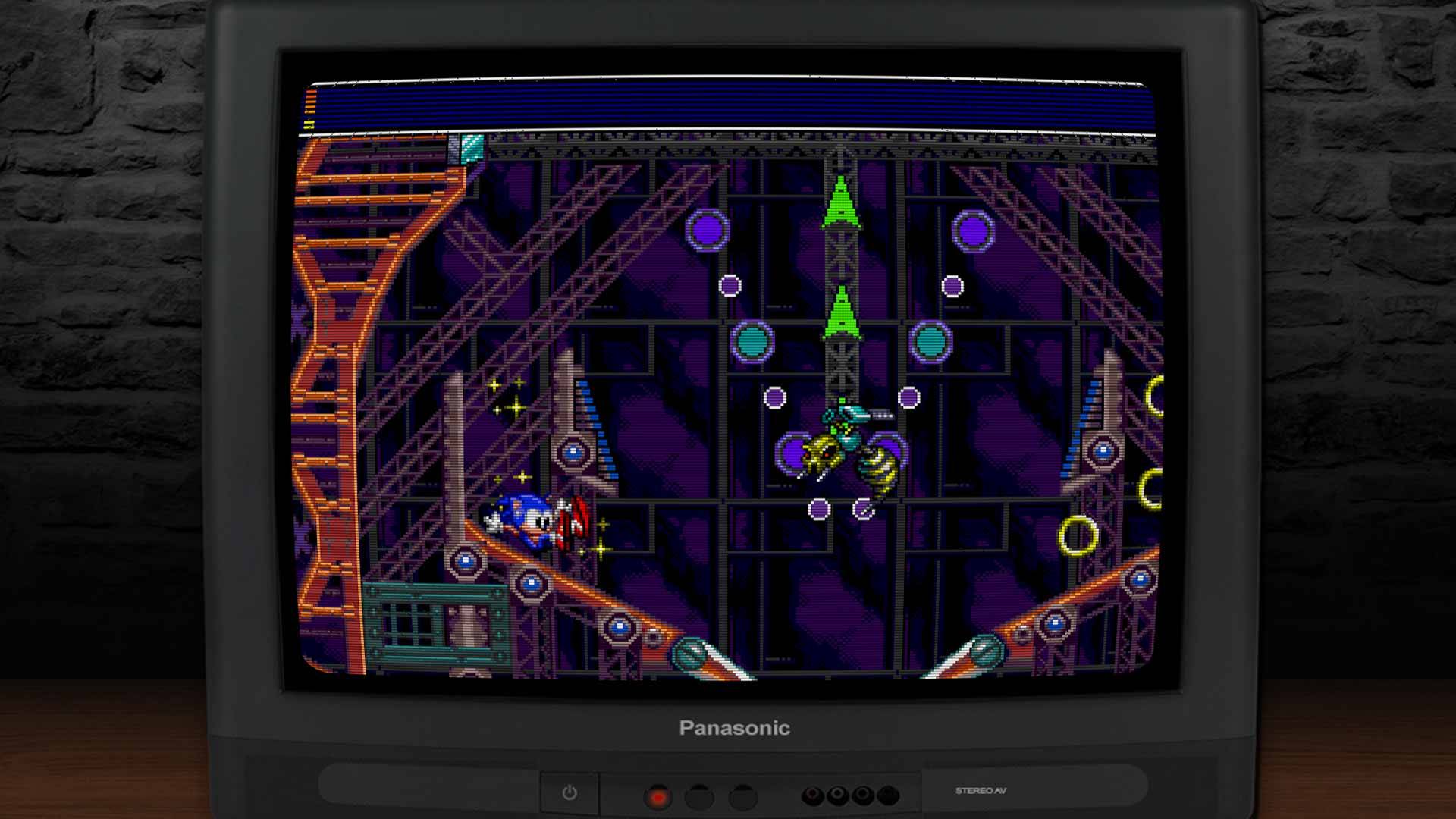 Sonic Spinball Level mit Pinball-Rampen, Ringen und einem Wespen-Gegner – lila Hintergrund und Stahlkonstruktion.