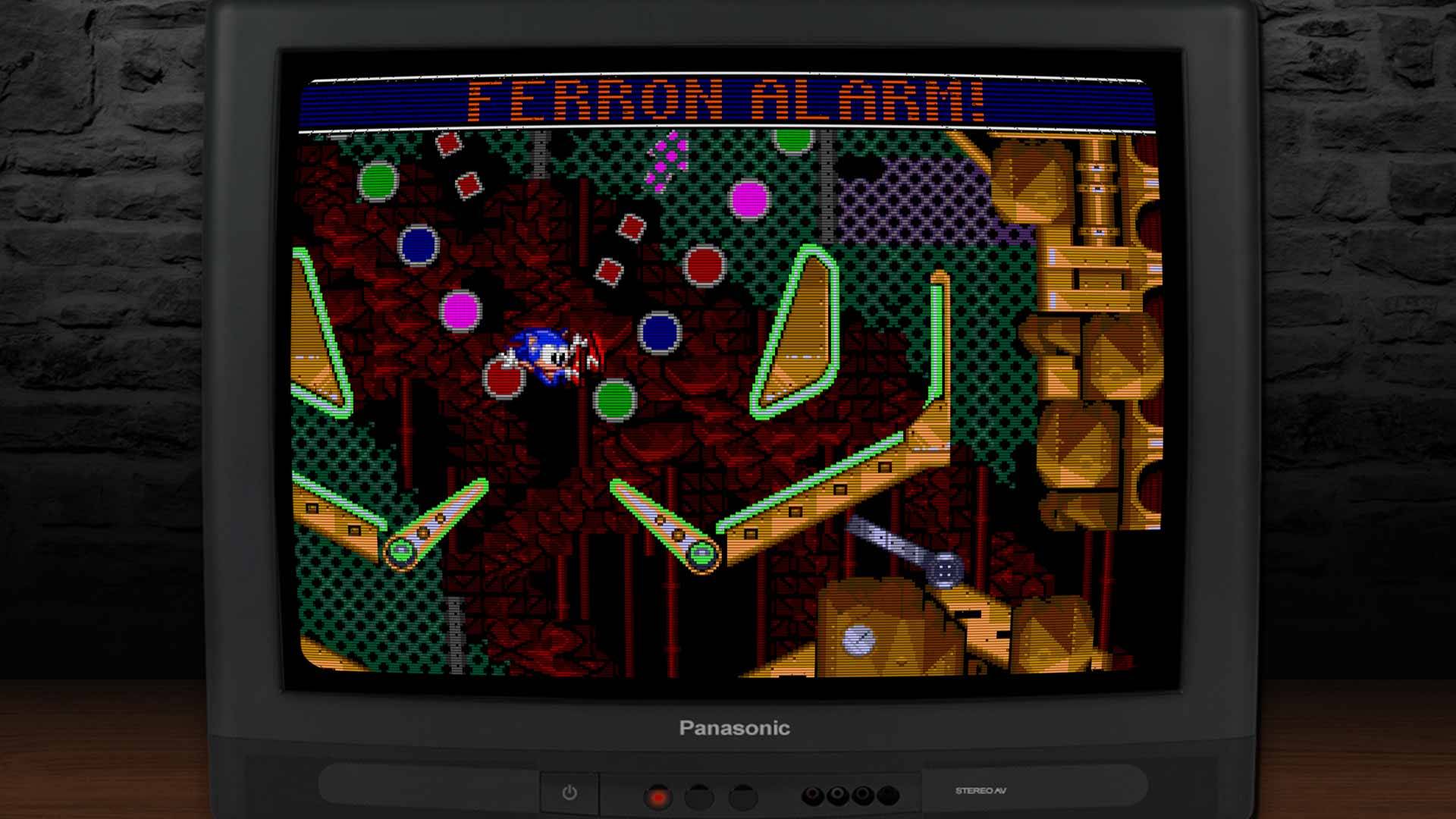 Actionreicher Flipperbereich mit Sonic zwischen Bumpern – Ferron Alarm blinkt im oberen Bildschirmrand.